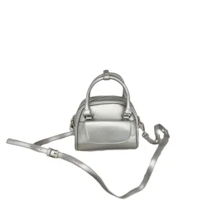 Silver metallic mini shoulder bag, PU leather crossbody handbag with top handle and strap.