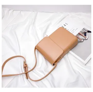Minimalist vertical mini crossbody phone bag in tan, retro daily shoulder bag for women.