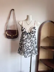 Detailed view of Korean vintage style camisole nightgown with lace trim and bow print details.