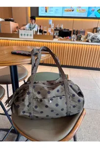 Niche design polka dot nylon shoulder bag, large capacity casual travel handbag for women.