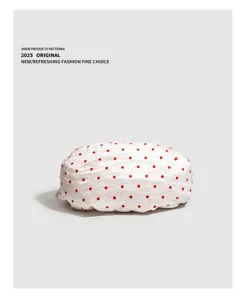 White pleated dumpling handbag detail with cute red polka dots, casual daily use style.