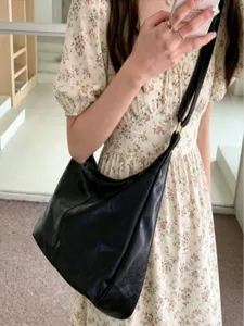 Stylish black slouchy shoulder bag for women, versatile PU leather hobo bag for summer daily wear.
