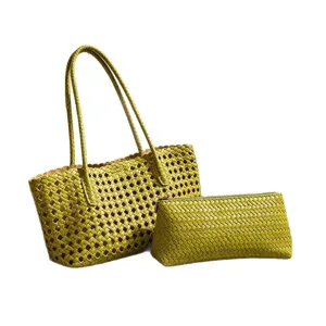Green woven leather tote bag for women, stylish summer beach vacation handbag and pouch set.