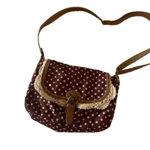 Women retro polka dot canvas messenger bag with lace trim and brown shoulder strap main view