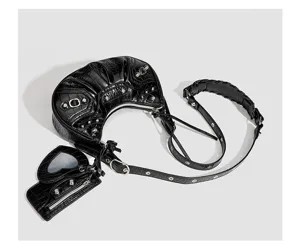 Detail view of the black crocodile embossed crescent shoulder bag with silver studs and heart mirror.