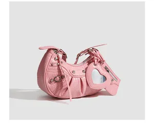 Pink crocodile pattern underarm bag with metal rivets and a cute heart-shaped mirror detail.