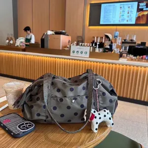 Niche design polka dot nylon shoulder bag, large capacity travel tote and casual handbag.