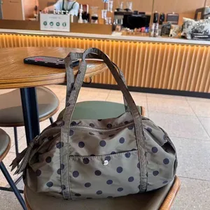 Nylon polka dot travel duffel bag, lightweight large capacity shoulder bag for sports and gym.