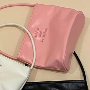 Minimalist pink PU leather shoulder bag detail, stylish daily underarm bag for women.