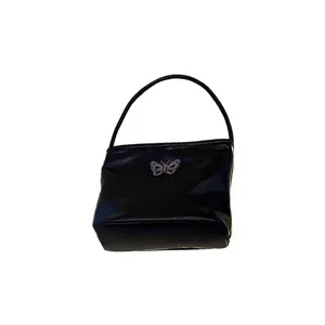 Black leather shoulder handbag with stylish silver butterfly embroidery for women daily wear.