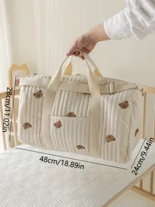 Quilted baby diaper bag with cute bear embroidery, portable travel stroller organizer.