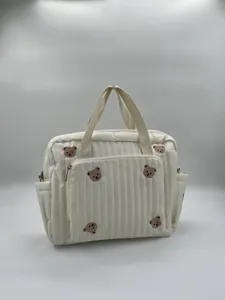 Detailed view of the cute quilted bear embroidered diaper tote bag, offering large capacity for moms.