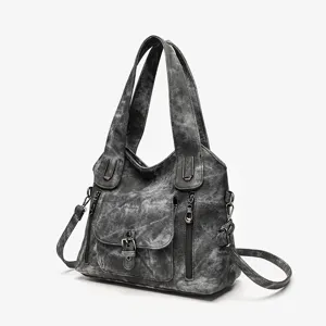 Detailed view of the vintage washed grey women handbag with multiple pockets and durable straps.