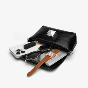 Black crocodile pattern crossbody bag with metal pyramid lock, stylish daily handbag.