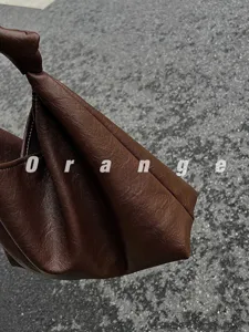 Brown leather knot hobo bag stylish minimalist shoulder tote for women daily commute style