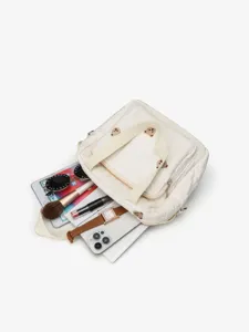 Detail shot of cute quilted tote bag with bear embroidery, stylish mom shoulder bag props.