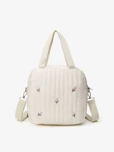 Detail view of the cute quilted embroidered tulip tote bag with convenient shoulder strap.