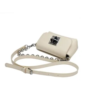 Cream leather crossbody bag detail, featuring silver pyramid clasp and decorative ball chain.