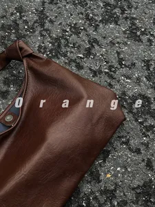 Detailed view of women's fashion brown shoulder tote bag, stylish casual commuter hobo bag.