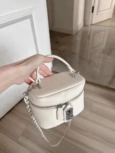 White pebbled leather vanity bag with top handle and silver chain strap stylish box handbag