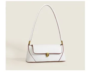 Detailed view of the elegant white retro baguette shoulder bag with chic gold hardware lock.