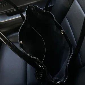 Black large capacity tote bag commuter shoulder bag with interior pocket and snap closure