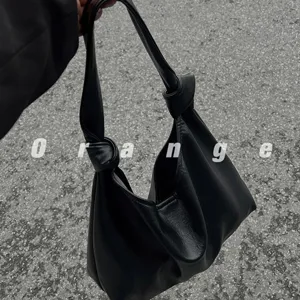 Stylish black hobo shoulder bag for women, trendy knot handle casual commuter tote bag.