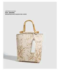 Vintage Chinese style bamboo handle handbag with elegant tassel, perfect for daily and retro outfits.