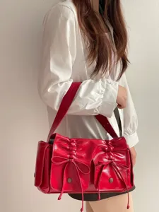 Sweet cool red patent leather shoulder bag with multi-pockets, bows and drawstrings.