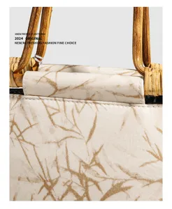 Retro Chinese style bamboo handle handbag detail featuring unique branch print fabric elegant.
