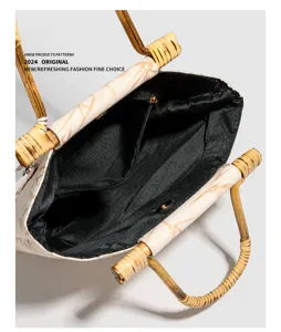Retro Chinese style bamboo handle handbag with patterned body and black interior lining detail