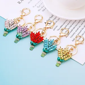 Detailed view of sparkling rhinestone bouquet keychains in multi-colors, metal key rings.