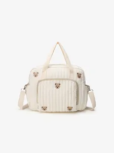 Quilted mommy diaper bag with cute bear embroidery, lightweight portable travel tote bag.