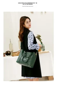 Detailed view of the dark green soft leather tote bag with large capacity and shoulder strap.