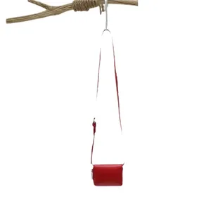 Red mini crossbody bag for women, stylish small shoulder bag with long strap and minimalist design.