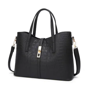 Stylish black crocodile pattern leather tote bag for women with gold hardware and shoulder strap.