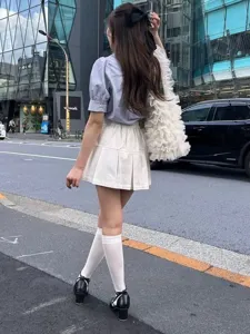 Tulle pleated tote bag in street scene, showing Japanese style design and large capacity.