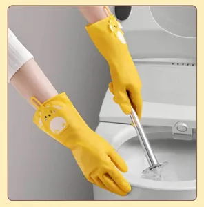 Close-up of durable yellow PVC household cleaning gloves with cute cartoon animal decor in use.