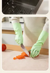 Detailed view of thickened household rubber gloves in use, waterproof and durable for kitchen tasks.
