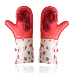 Red silicone cleaning gloves with strawberry pattern and scrubbing brush for kitchen housework.