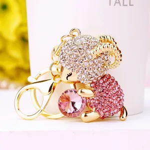 Cute rhinestone sheep keychain with sparkling pink crystal, metal bag charm pendant accessory.