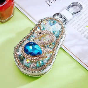 Exquisite full rhinestone swan car key case detailed view, sparkling crystals and metal hardware.