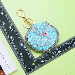 Cute rhinestone rabbit ear mirror keychain, glitter bag charm for women and girls daily use.