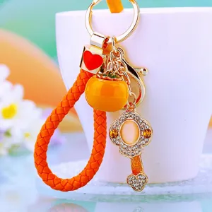 Cute orange persimmon metal keychain and bag pendant with braided leather strap for women