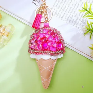 Detailed close-up of a sparkling pink rhinestone ice cream cone keychain with cute tassel.