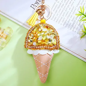 Creative rhinestone ice cream keychain, PU leather bag charm with yellow crystals and tassel.