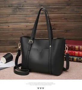 Black soft leather tote bag detail view, casual shoulder crossbody bag with elegant double handles.