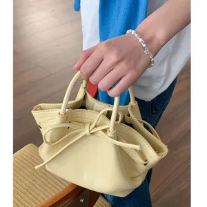 Borsa a secchiello gialla da donna, elegante borsa a mano con fiocco e coulisse carina.