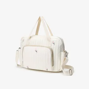 White quilted diaper bag with cute tulip embroidery, versatile shoulder and crossbody mommy bag.
