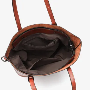 Retro oil wax leather tote bag interior detail, brown women's shoulder bag with zipper.